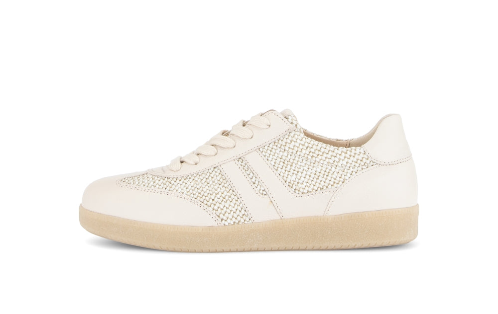 White sneaker with beige sole on a white background