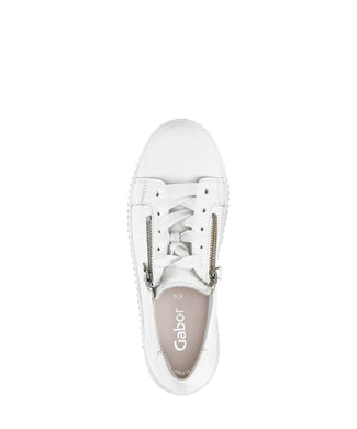 White sneaker with a gold zipper on a white background
