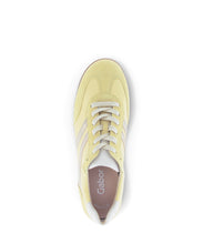 Load image into Gallery viewer, Yellow sneaker with white laces on a white background
