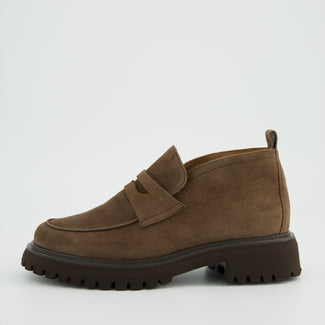 Brown suede loafer shoe on a light gray background