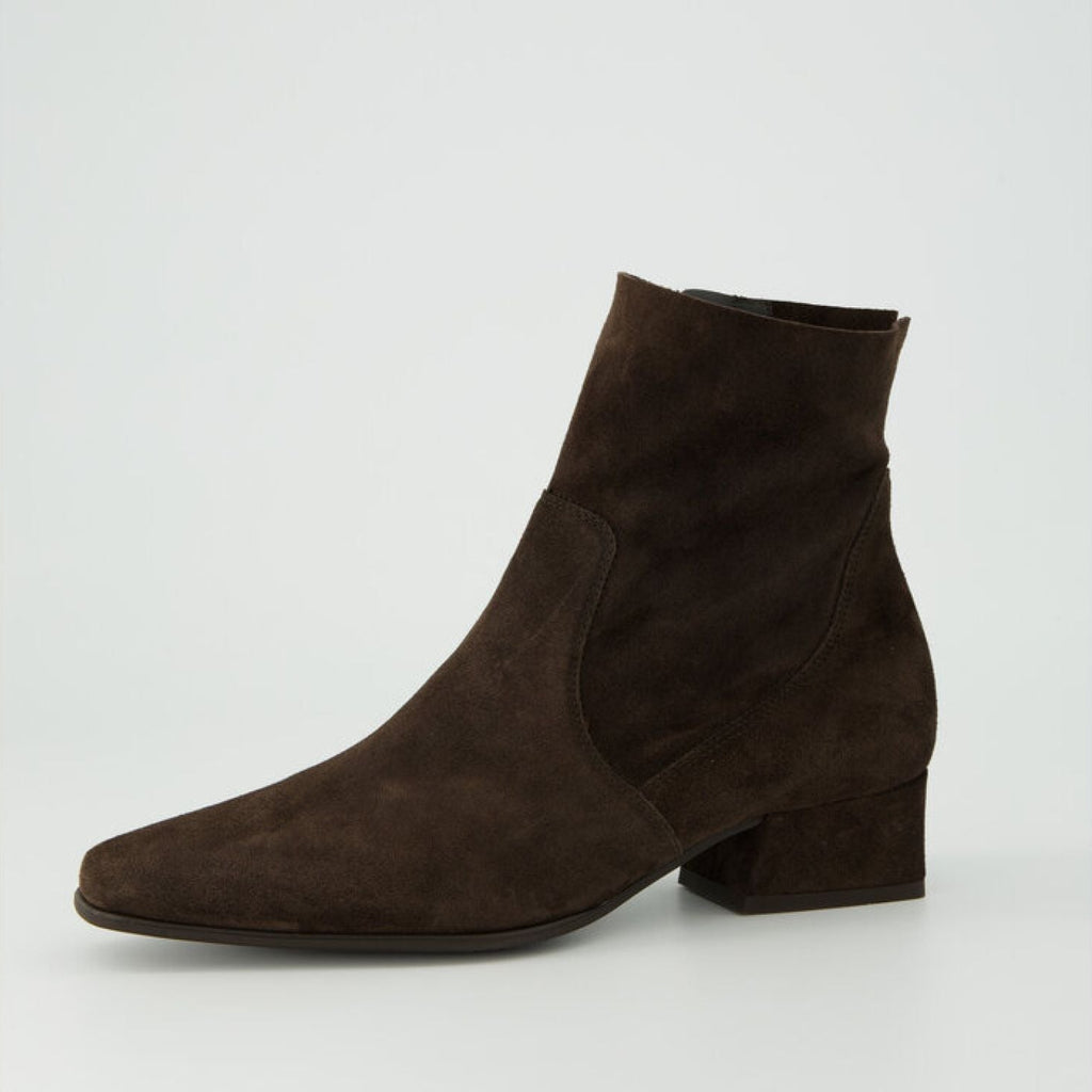 Brown suede ankle boot on a light gray background