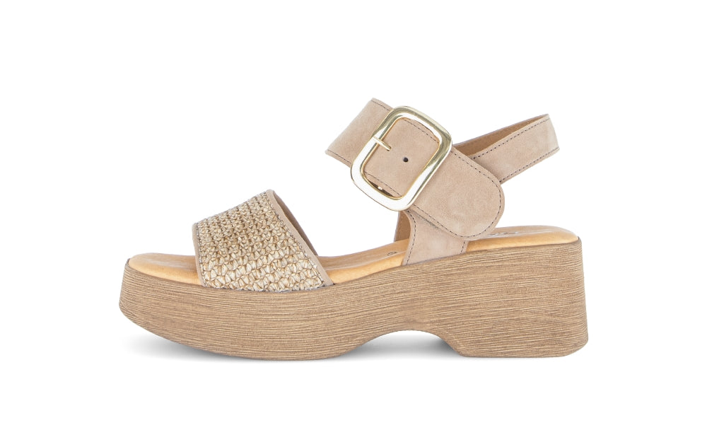 Beige platform sandal with a buckle on a white background