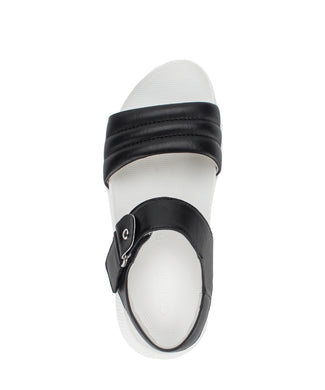 Black sandal with white sole on a white background