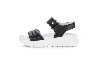Black sandal with white sole on a white background