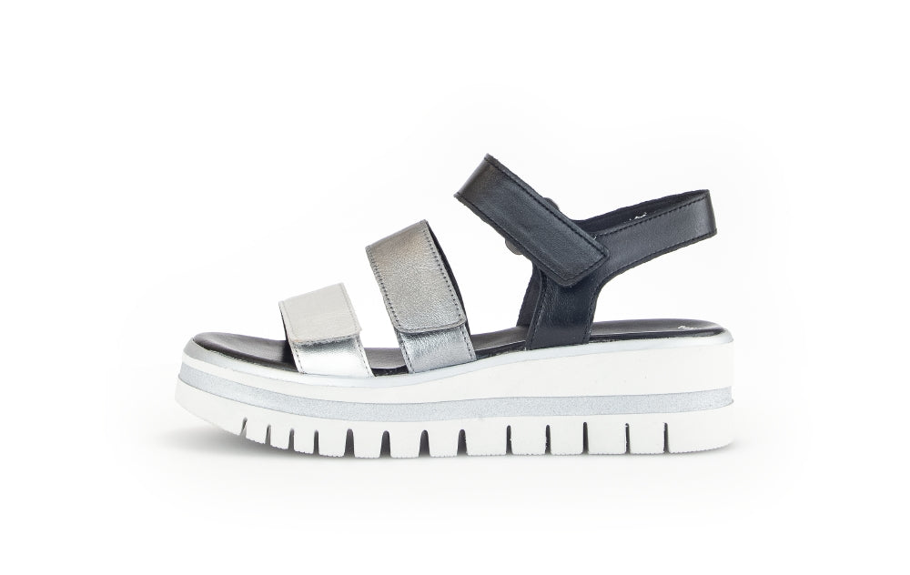 Black and silver sandal on a white background