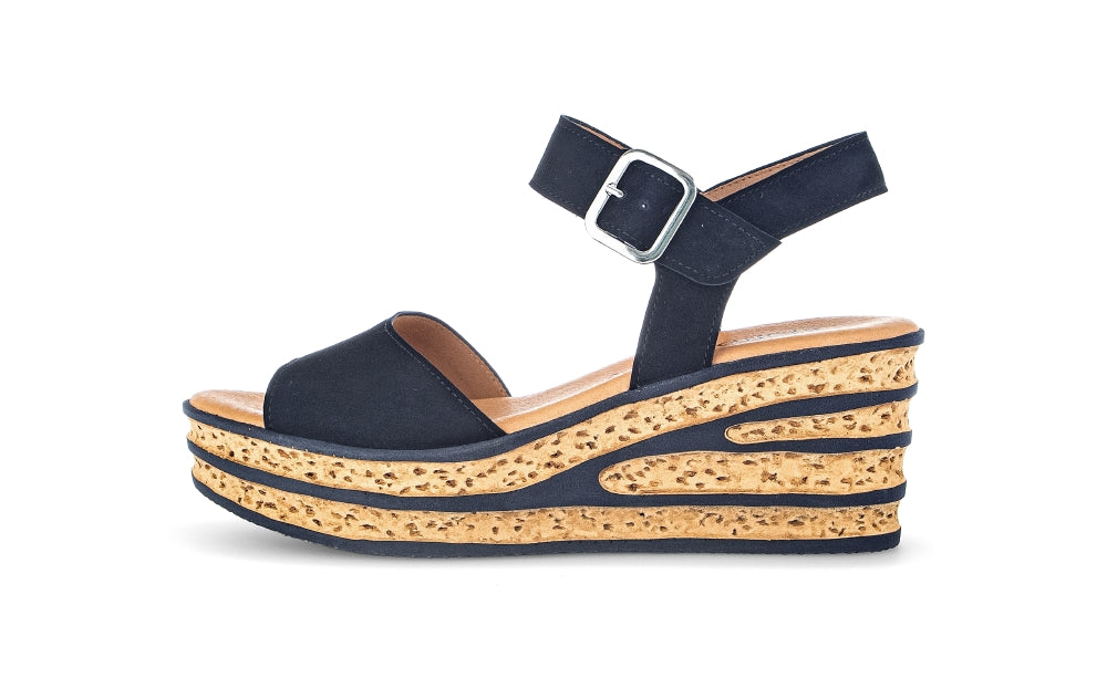 Navy wedge sandal with cork platform on a white background