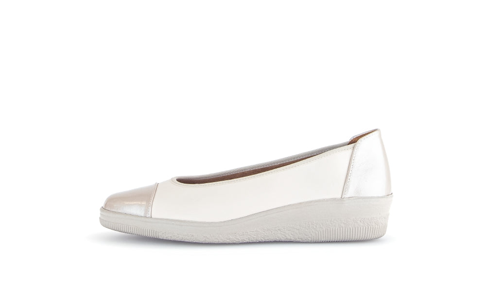 White flat shoe with  heel on a white background