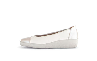White flat shoe with  heel on a white background