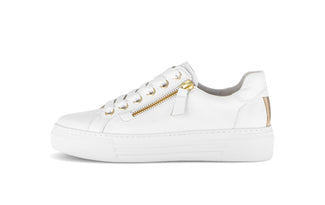 White sneaker with gold zipper on a white background