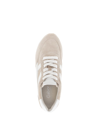 Beige sneaker with white accents on a white background