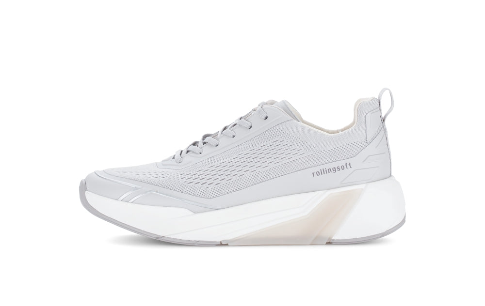 Gray athletic shoe with a white sole on a light gray background