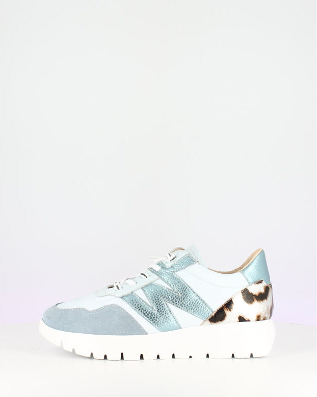 Light blue sneaker with leopard print accents on a white background