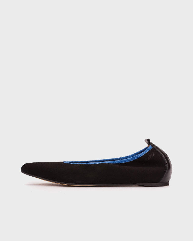 Black flat shoe with blue interior on a white background