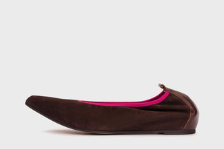 Brown flat shoe with pink interior on a white background