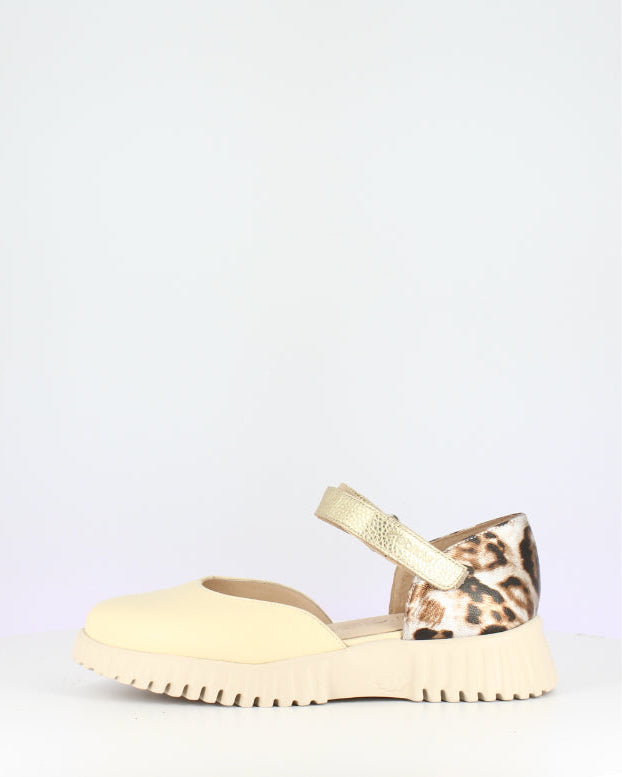 Beige sandal with leopard print strap on a white background