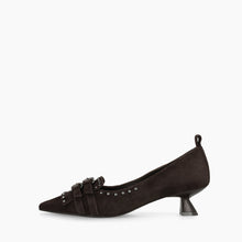 Load image into Gallery viewer, A single dark brown suede pointed-toe pump with a low kitten heel, decorative straps, and silver studs, shown in profile against a plain white background.
