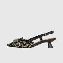 Load image into Gallery viewer, Leopard print slingback shoe with a crystal embellishment on a light gray background
