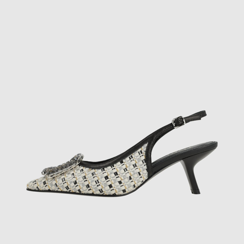 Black and white patterned slingback shoe on a light gray background