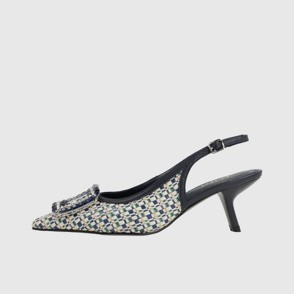 Patterned high-heeled shoe with a checkered design on a light gray background