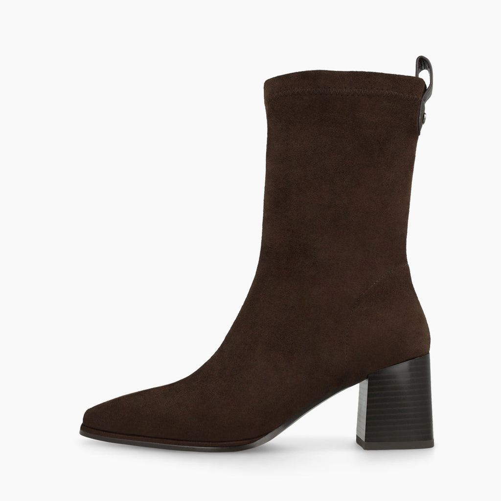 A dark brown suede ankle boot with a chunky black block heel and a small side pull tab, shown in profile against a plain white background.