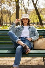 Load image into Gallery viewer, A low-top sneaker in dark brown leather with a tan cross logo on the side, a tan heel tab, and a gum sole, shown from the side against a white background.
