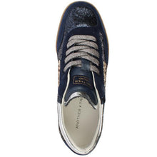 Load image into Gallery viewer, A top-down view of a navy blue sneaker with textured snakeskin and leopard print panels, metallic silver laces, and a white interior lining.
