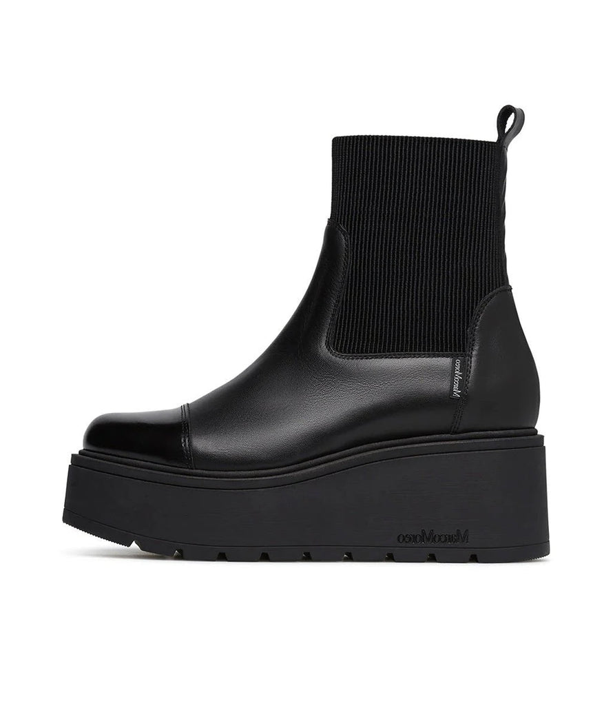 Black platform Chelsea boot on a white background