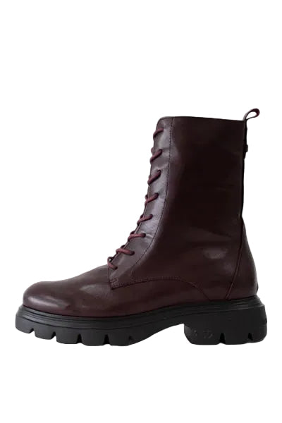A dark burgundy leather lace-up ankle boot with a chunky black lug sole, shown in a side profile against a light gray background.