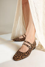 Load image into Gallery viewer, Leopard print shoes worn with a white dress on a neutral background
