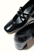Load image into Gallery viewer, Black shiny shoes with a strap on a white background

