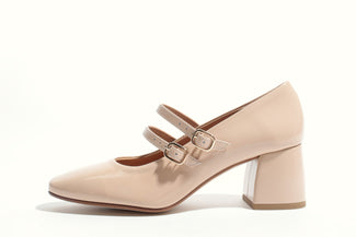 Beige shoe with a strap on a white background