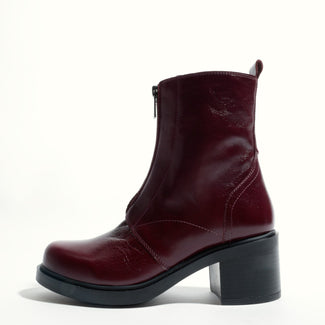 Burgundy ankle boot on a white background
