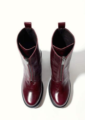 Burgundy ankle boot on a white background