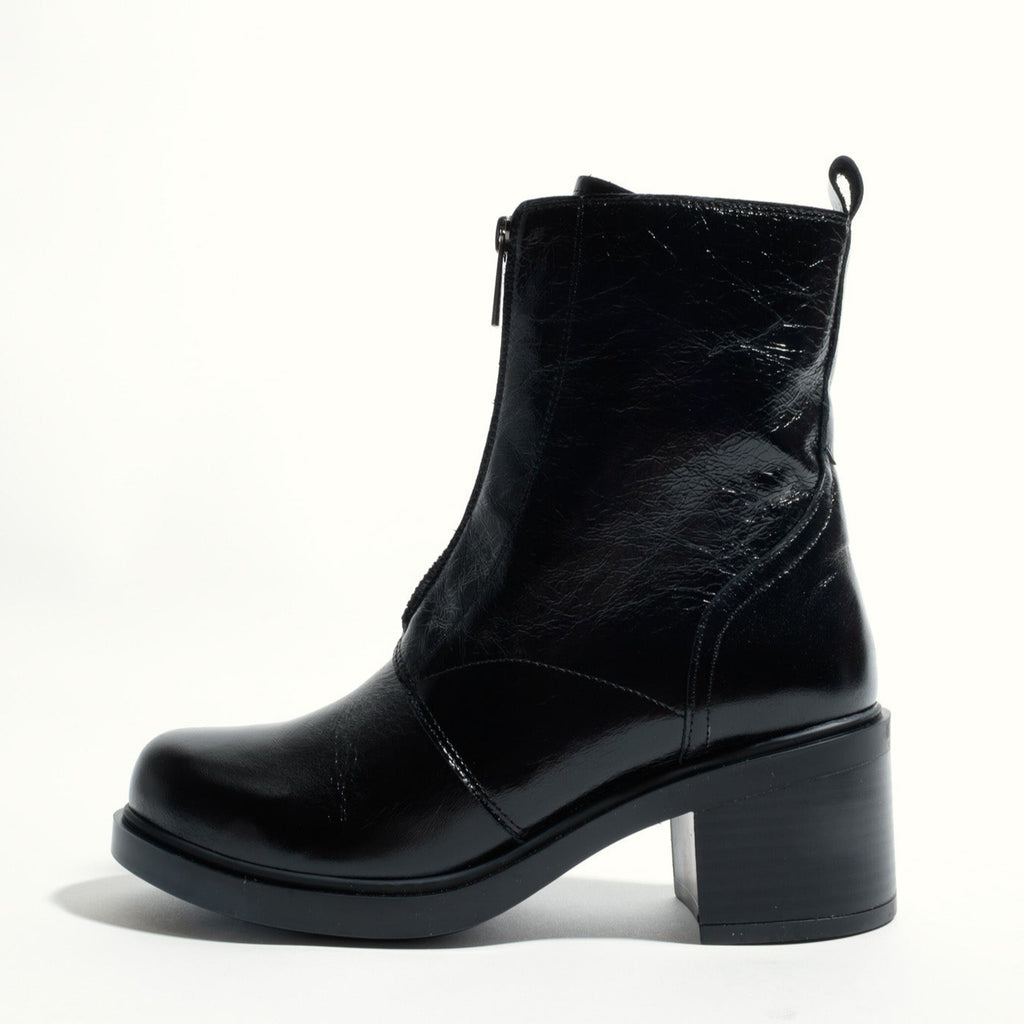Black leather ankle boot on a white background