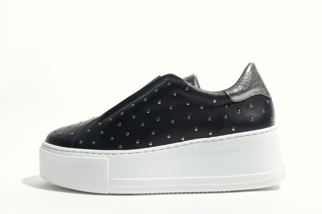 Black sneaker with white sole on a white background