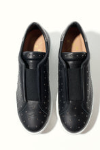 Load image into Gallery viewer, Pair of black studded sneakers on a white background
