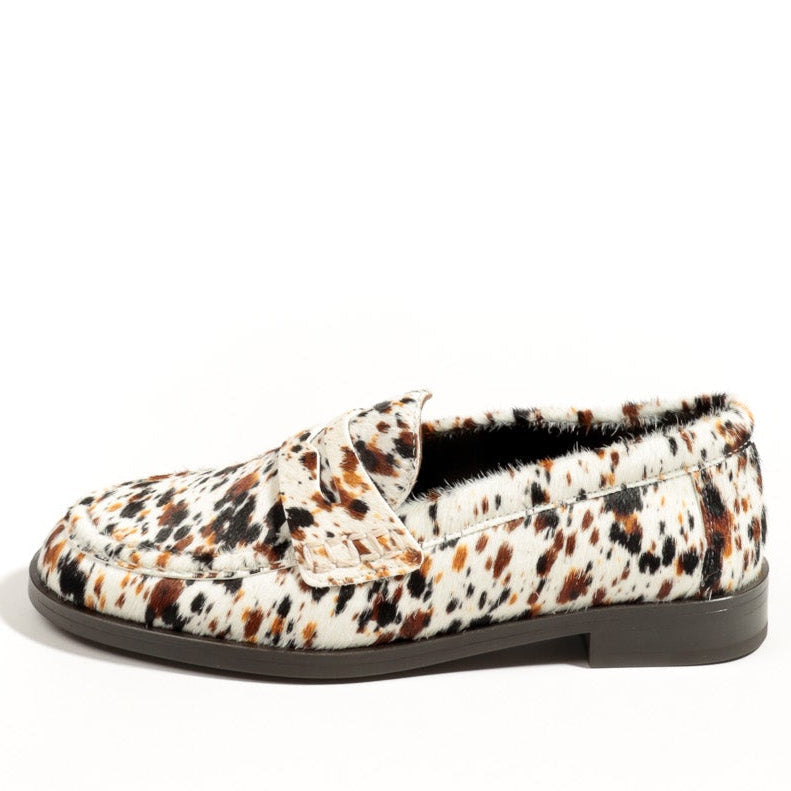 Floral patterned slip-on shoe on a white background