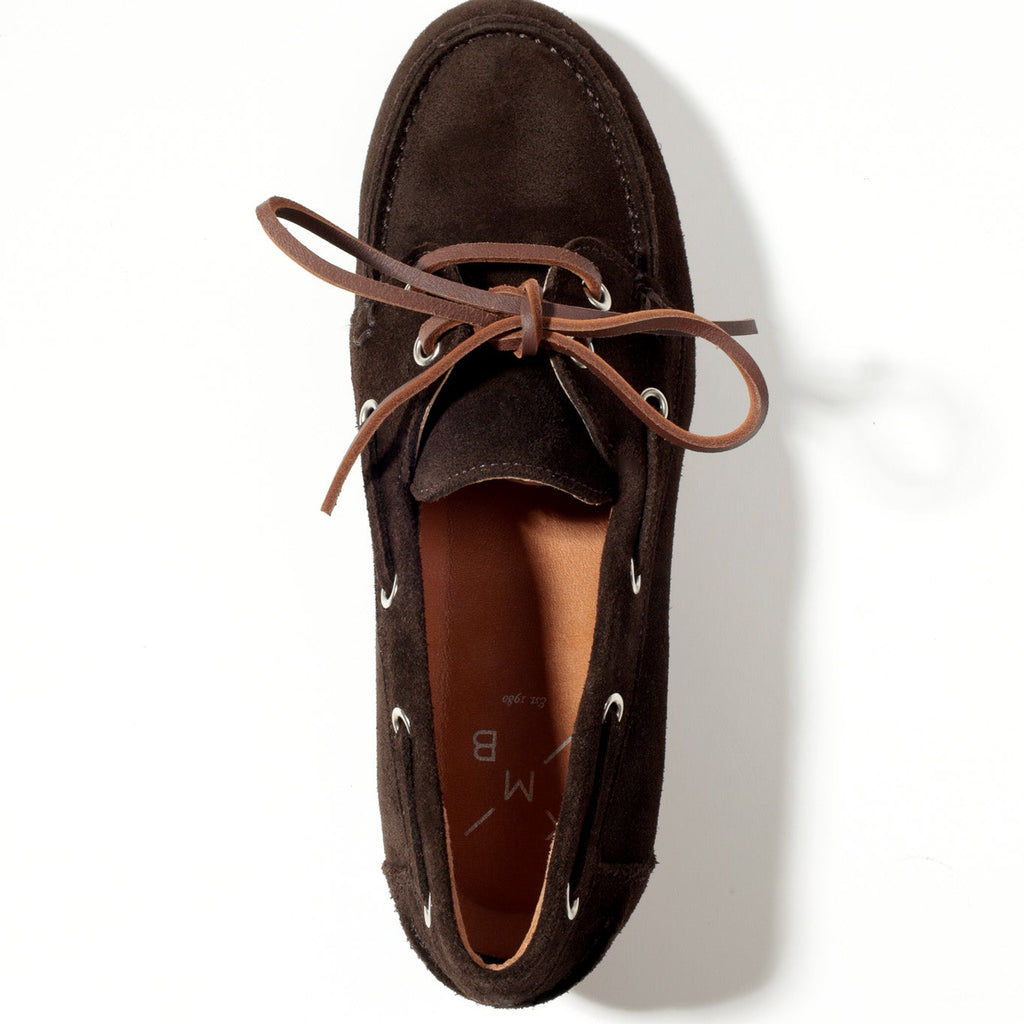 Brown suede loafer shoe on a white background