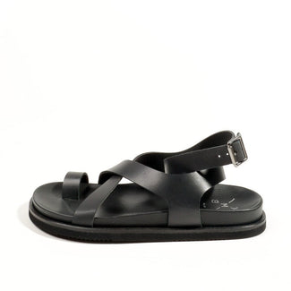 Black slip-on shoe on a white background