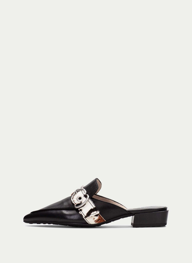 Black slip-on shoe with a metallic buckle on a white background