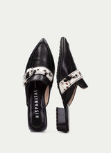Load image into Gallery viewer, Black pointed-toe shoes with metallic embellishments on a light gray background

