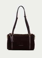 Load image into Gallery viewer, A dark brown suede shoulder bag with black leather trim and straps, featuring gold-tone hardware and the brand name 'NIPPARITAS' printed in gold on the front, set against a light gray background.
