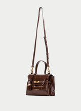 Load image into Gallery viewer, A dark brown crocodile-embossed leather handbag with a top handle, a long shoulder strap, and gold-tone hardware, shown against a light gray background.
