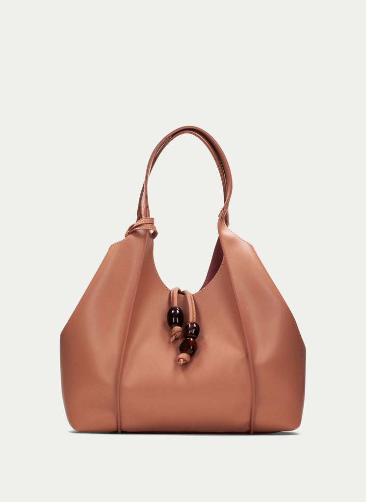 Brown leather handbag on a light gray background