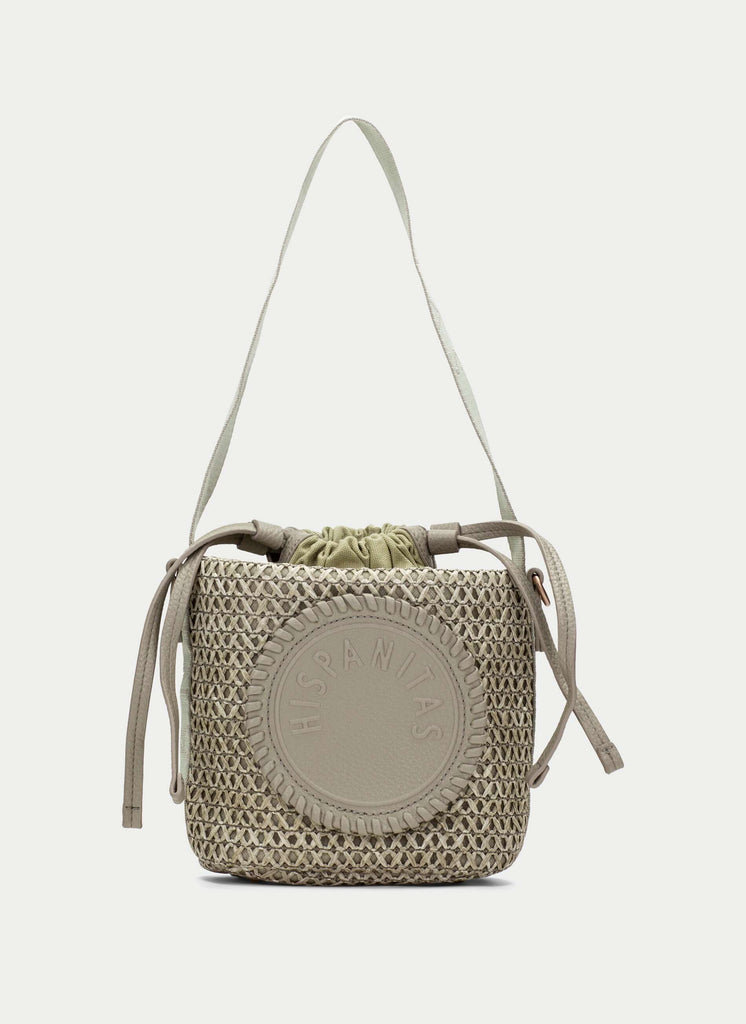 Woven handbag with drawstring top on a white background