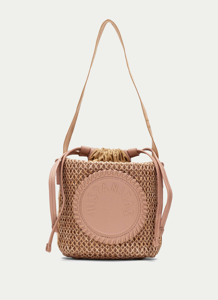 Woven handbag with a strap on a white background