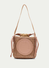 Load image into Gallery viewer, Woven handbag with a strap on a white background
