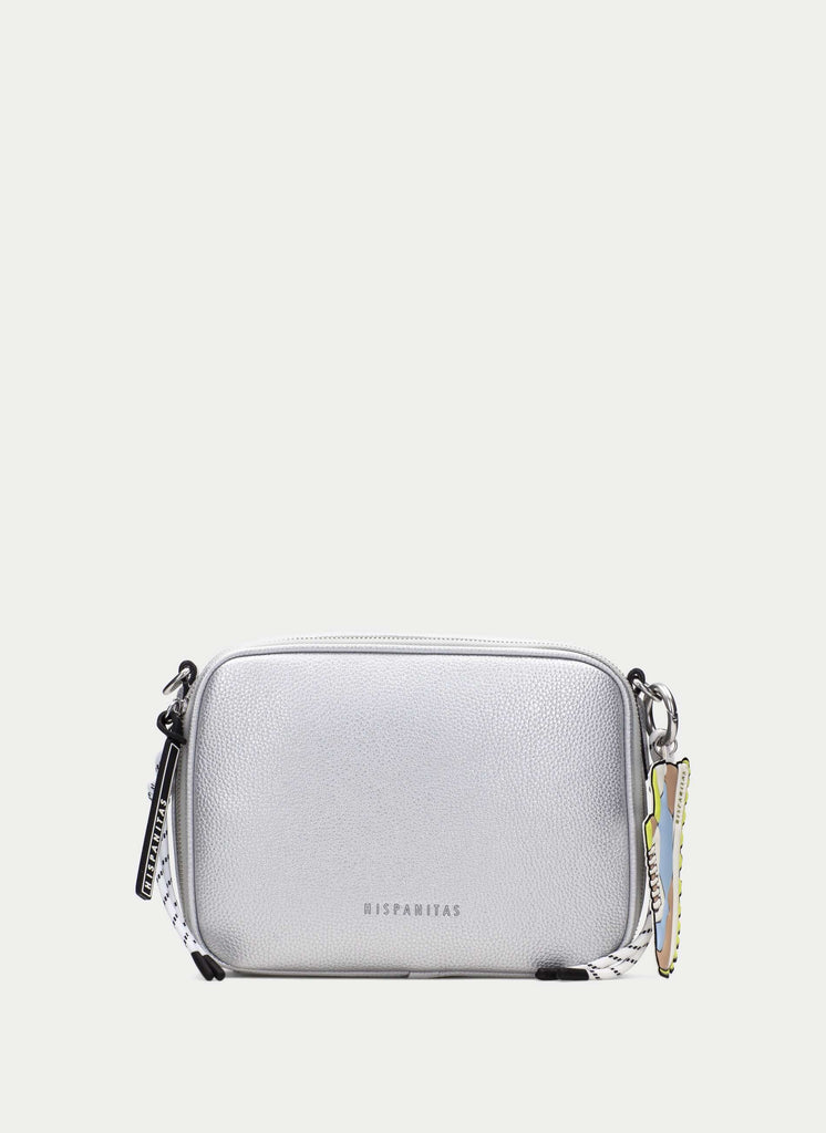 Silver crossbody bag with a chain detail on a light gray background