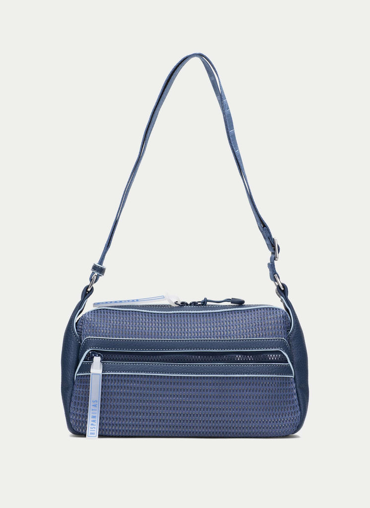 Blue textured handbag with a strap on a light gray background