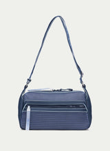 Load image into Gallery viewer, Blue textured handbag with a strap on a light gray background
